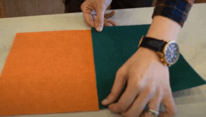 The supplier showing how to align orange and green event carpet